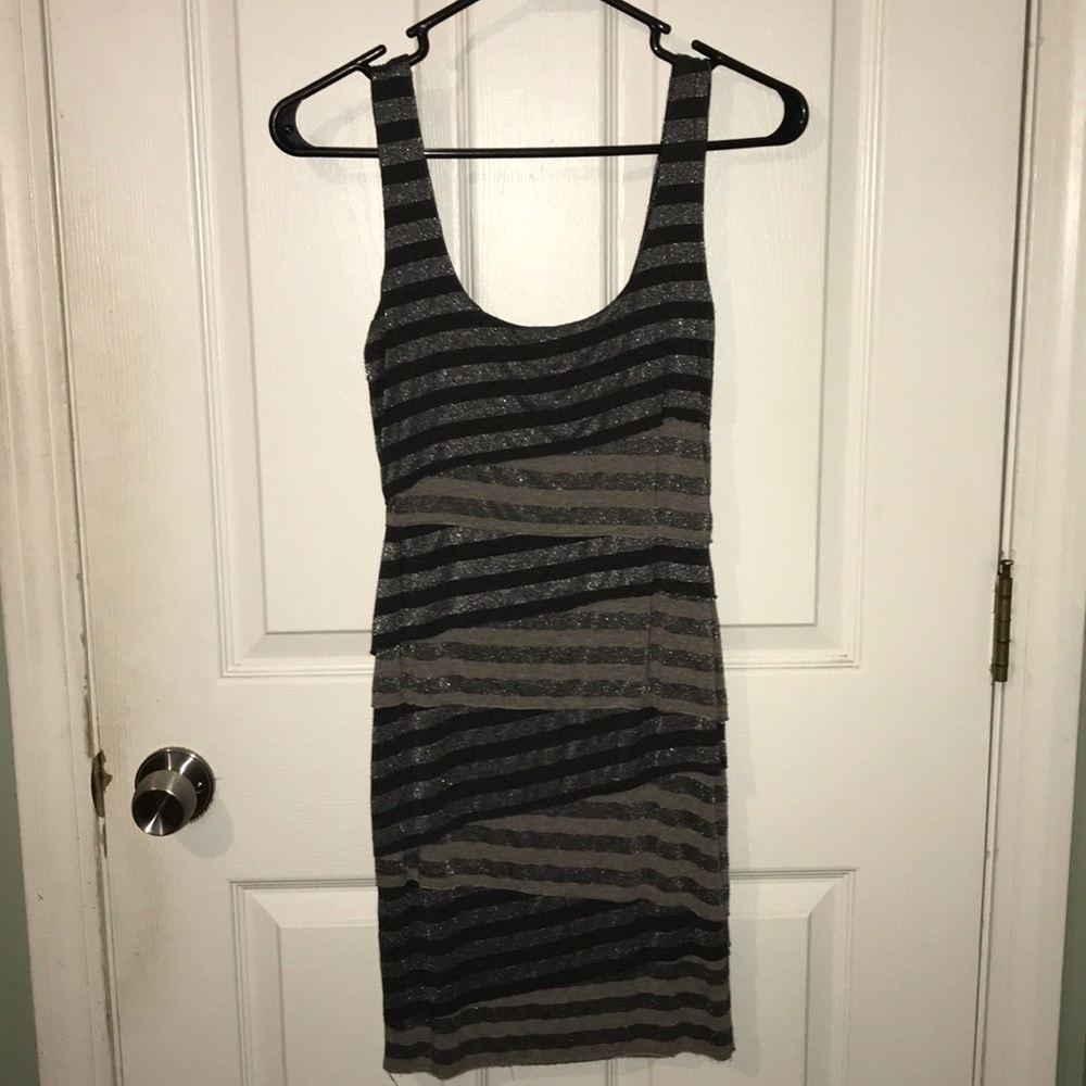 Sleeveless, tiered fitted dress.